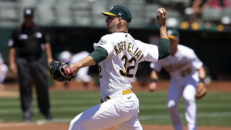 Jul 20, 2021; Oakland, California, USA; Oakland Athletics starting pitcher James Kaprielian (32) delivers against the Los Angeles Angels during the first inning at RingCentral Coliseum. Mandatory Credit: D. Ross Cameron-USA TODAY Sports