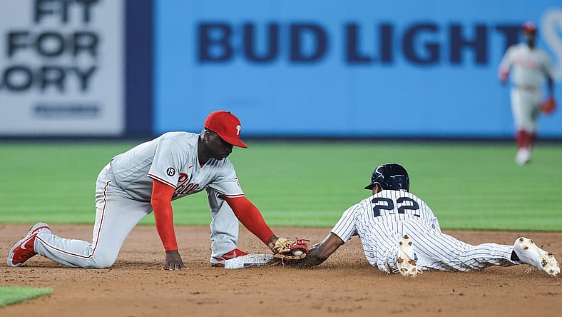 Jul 20, 2021; Bronx, New York, USA; New York Yankees left fielder Greg Allen (22) steals second base as Philadelphia Phillies shortstop Didi Gregorius (18) applies a late tag during the fifth inning at Yankee Stadium. Mandatory Credit: Vincent Carchietta-USA TODAY Sports