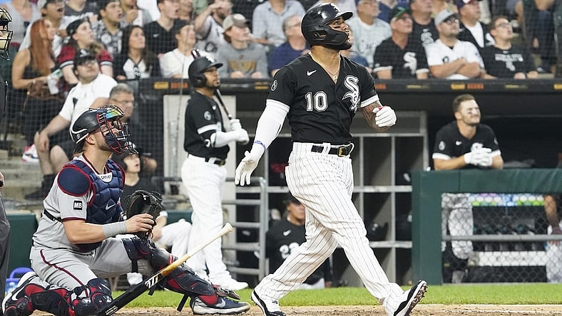 Jul 20, 2021; Chicago, Illinois, USA; Chicago White Sox third baseman Yoan Moncada (10) hits a two-run home run against the Minnesota Twins during the third inning at Guaranteed Rate Field. Mandatory Credit: David Banks-USA TODAY Sports