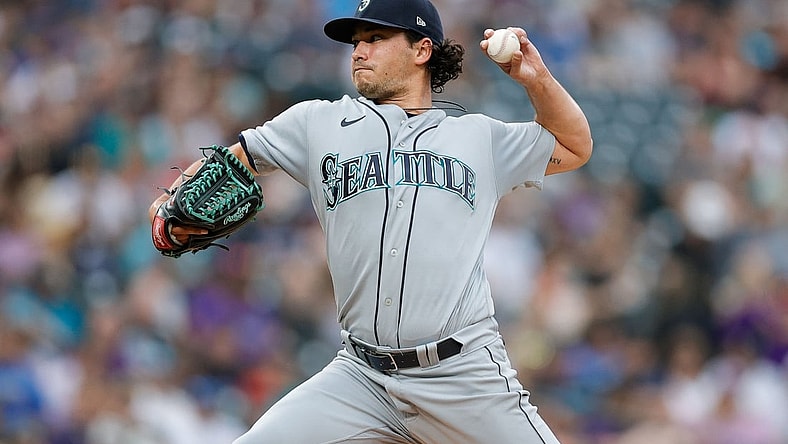 Jul 20, 2021; Denver, Colorado, USA; Seattle Mariners starting pitcher Marco Gonzales (7) pitches in the second inning against the Colorado Rockies at Coors Field. Mandatory Credit: Isaiah J. Downing-USA TODAY Sports