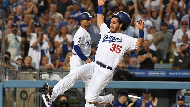Jul 21, 2021; Los Angeles, California, USA;  Los Angeles Dodgers center fielder Cody Bellinger (35) runs home to score on a double hit by left fielder AJ Pollock (not pictured) in the fourth inning against the San Francisco Giants at Dodger Stadium. Mandatory Credit: Richard Mackson-USA TODAY Sports