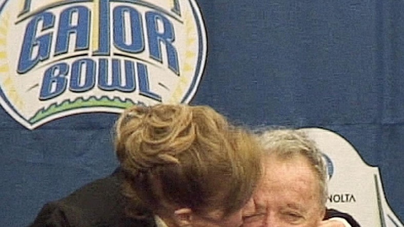Jan. 1, 2010: Legendary Florida State University football coach Bobby Bowden's wife, Ann, gives him a kiss during the post game press conference after his final game against West Virginia at Jacksonville Municipal Stadium for the Gator Bowl. [Kelly Jordan, Florida Times-Union]