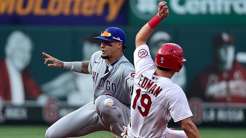 Jul 22, 2021; St. Louis, Missouri, USA;  Chicago Cubs shortstop Javier Baez (9) catches the throw and tags out St. Louis Cardinals second baseman Tommy Edman (19) as he attempts to steal second during the second inning at Busch Stadium. Mandatory Credit: Jeff Curry-USA TODAY Sports