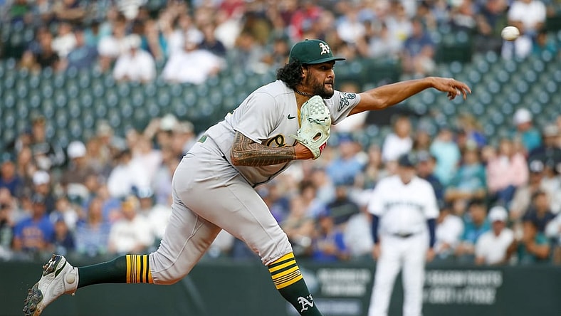 Jul 22, 2021; Seattle, Washington, USA; Oakland Athletics starting pitcher Sean Manaea (55) throws against the Seattle Mariners during the first inning at T-Mobile Park. Mandatory Credit: Joe Nicholson-USA TODAY Sports