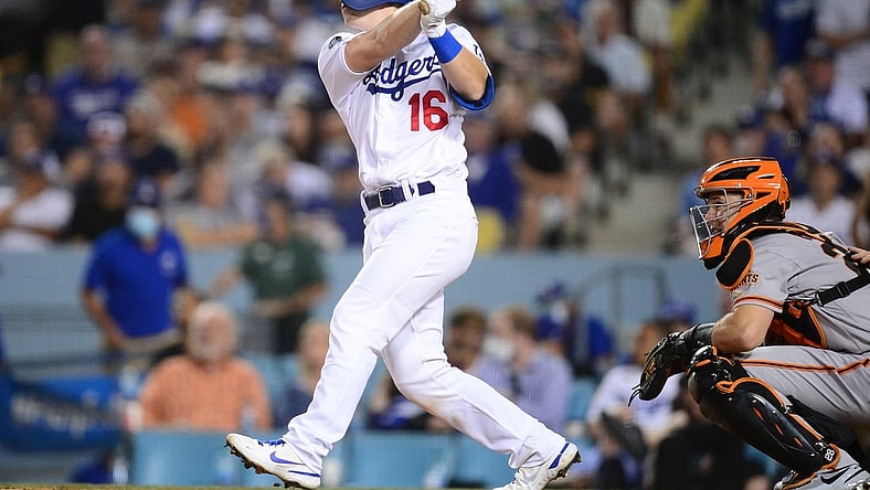 Jul 22, 2021; Los Angeles, California, USA; Los Angeles Dodgers catcher Will Smith (16) hits a two run home run against the San Francisco Giants during the fourth inning at Dodger Stadium. Mandatory Credit: Gary A. Vasquez-USA TODAY Sports