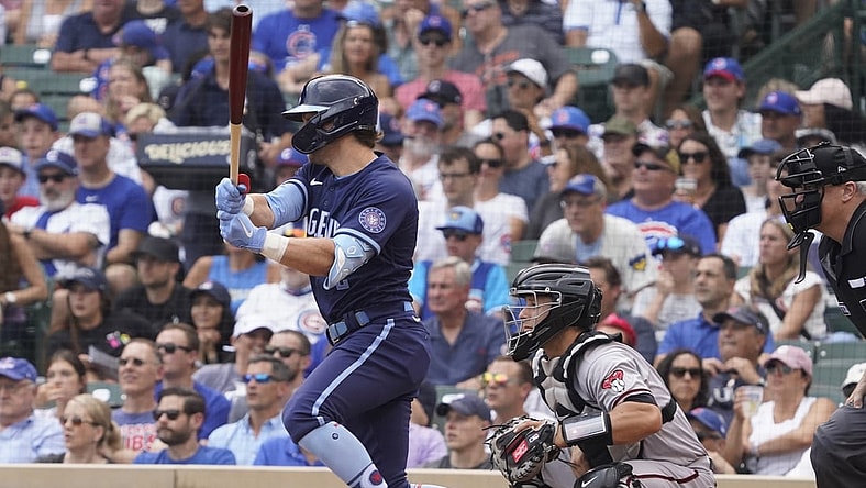 Jul 23, 2021; Chicago, Illinois, USA; Chicago Cubs second baseman Nico Hoerner (2)  hits a two run single against the Arizona Diamondbacks during the third inning at Wrigley Field. Mandatory Credit: David Banks-USA TODAY Sports