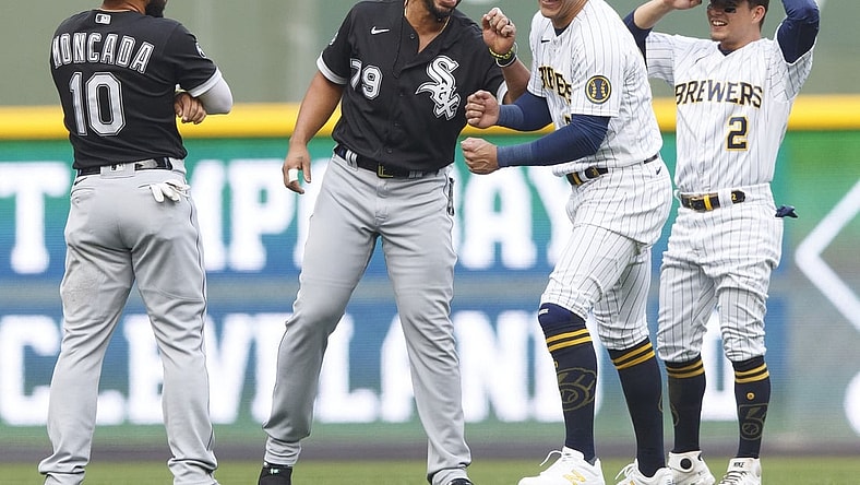 Jul 23, 2021; Milwaukee, Wisconsin, USA;  Chicago White Sox first baseman Jose Abreu (79) and Milwaukee Brewers right fielder Avisa l Garc a (24) meet before the game at American Family Field. Mandatory Credit: Jeff Hanisch-USA TODAY Sports
