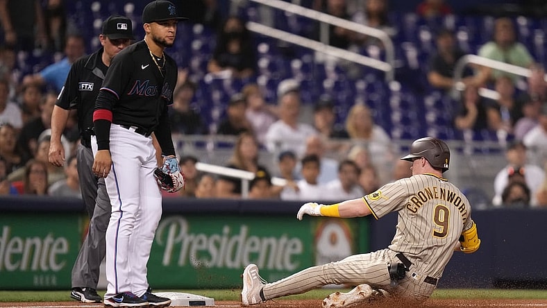 Jul 23, 2021; Miami, Florida, USA; San Diego Padres second baseman Jake Cronenworth (9) slides safely into third base for a triple in the 1st inning against the Miami Marlins at loanDepot park. Mandatory Credit: Jasen Vinlove-USA TODAY Sports