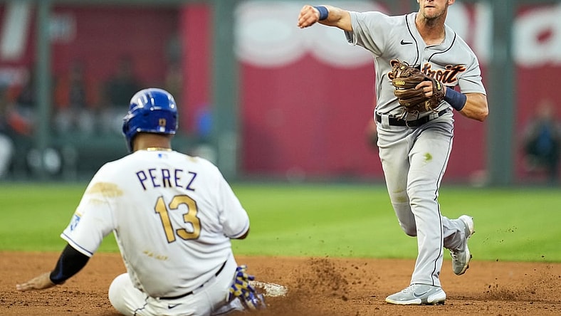 Jul 23, 2021; Kansas City, Missouri, USA; Detroit Tigers shortstop Zack Short (59) throws to first base after forcing out Kansas City Royals catcher Salvador Perez (13) during the fourth inning at Kauffman Stadium. Mandatory Credit: Jay Biggerstaff-USA TODAY Sports