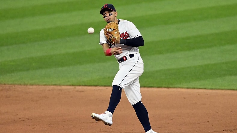 Jul 24, 2021; Cleveland, Ohio, USA; Cleveland Indians second baseman Cesar Hernandez (7) throws to first base against the Tampa Bay Rays in the eighth inning at Progressive Field. Mandatory Credit: David Richard-USA TODAY Sports