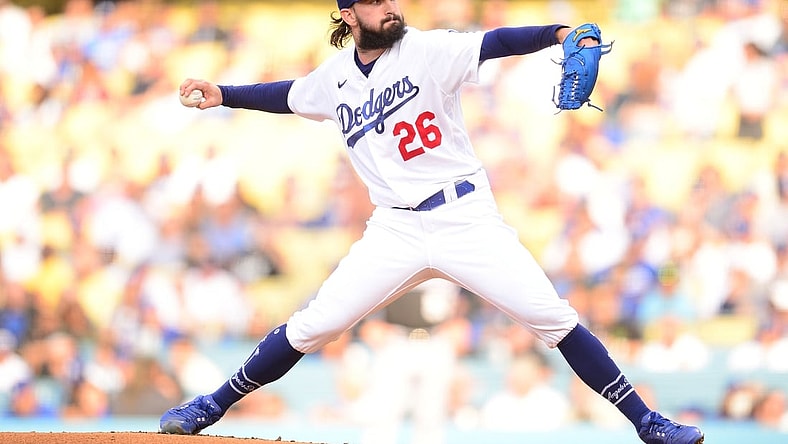 Jul 24, 2021; Los Angeles, California, USA; Los Angeles Dodgers starting pitcher Tony Gonsolin (26) throws against the Colorado Rockies during the first inning at Dodger Stadium. Mandatory Credit: Gary A. Vasquez-USA TODAY Sports