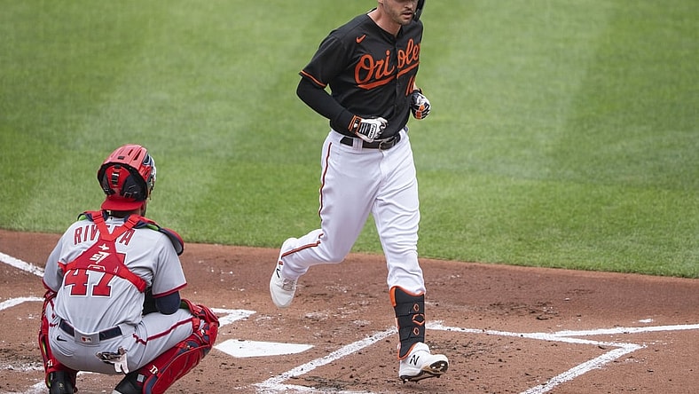 Jul 25, 2021; Baltimore, Maryland, USA; Baltimore Orioles designated hitter Trey Mancini (16) crosses home plate after hitting a home run during the first inning against the Washington Nationals at Orioles Park at Camden Yards. Mandatory Credit: Gregory Fisher-USA TODAY Sports