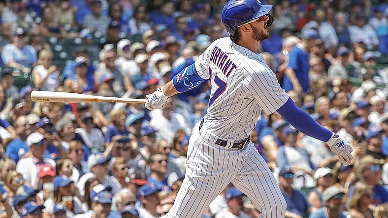 Jul 25, 2021; Chicago, Illinois, USA; Chicago Cubs third baseman Kris Bryant (17) hits a two-run home run against the Arizona Diamondbacks during the first inning at Wrigley Field. Mandatory Credit: Kamil Krzaczynski-USA TODAY Sports