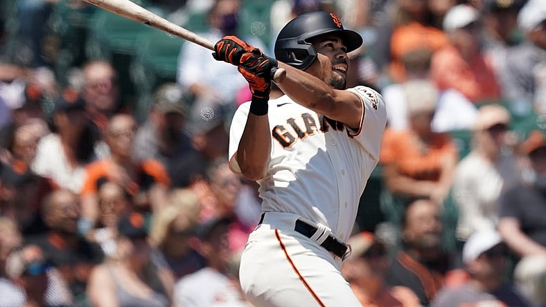 Jul 25, 2021; San Francisco, California, USA; San Francisco Giants right fielder LaMonte Wade Jr (31) hits a home run during the third inning against the Pittsburgh Pirates at Oracle Park. Mandatory Credit: Darren Yamashita-USA TODAY Sports