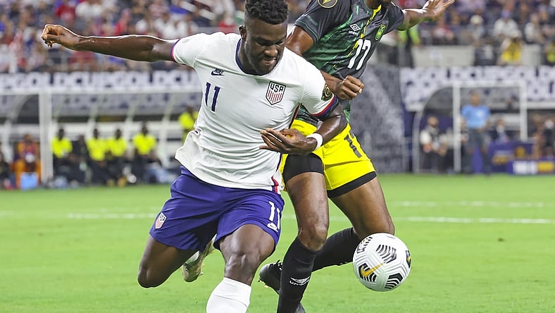 Jul 25, 2021; Arlington, Texas, USA; United States forward Daryl Dike (11) and Jamaica defender Damion Lowe (17)  battle for the ball during the first half of a CONCACAF Gold Cup quarterfinal soccer match at AT&T Stadium. Mandatory Credit: Kevin Jairaj-USA TODAY Sports