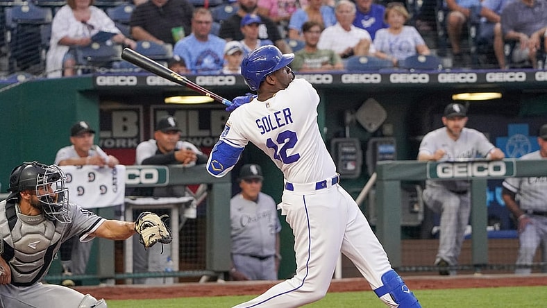 Jul 26, 2021; Kansas City, Missouri, USA; Kansas City Royals designated hitter Jorge Soler (12) connects for a solo home run in the fourth inning against the Chicago White Sox at Kauffman Stadium. Mandatory Credit: Denny Medley-USA TODAY Sports