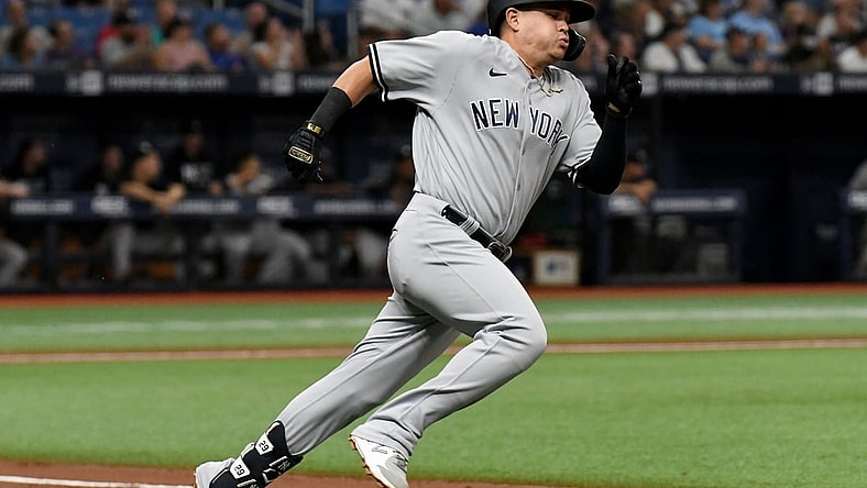 Jul 27, 2021; St. Petersburg, Florida, USA; New York Yankees third baseman Gio Urshela (29) hits a double against the Tampa Bay Rays in the second inning at Tropicana Field. Mandatory Credit: Jonathan Dyer-USA TODAY Sports