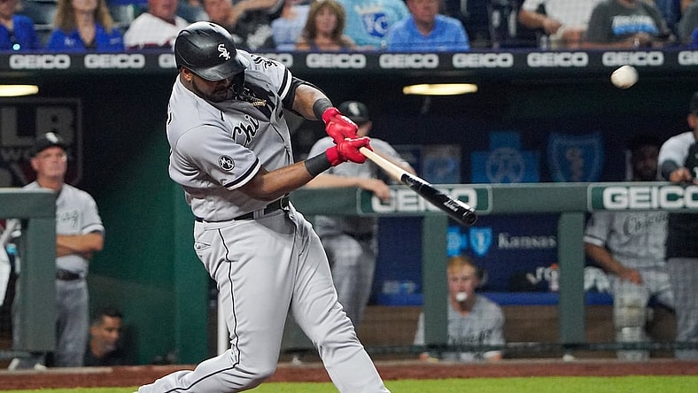 Jul 27, 2021; Kansas City, Missouri, USA; Chicago White Sox left fielder Eloy Jimenez (74) connects for a three run home run in the eighth inning against the Kansas City Royals at Kauffman Stadium. Mandatory Credit: Denny Medley-USA TODAY Sports