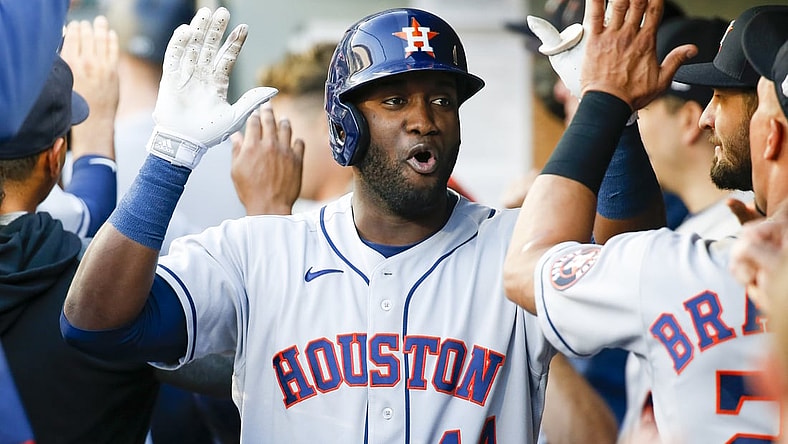 Jul 27, 2021; Seattle, Washington, USA; Houston Astros left fielder Yordan Alvarez (44) exchanges high fives in the dugout after hitting a three-run home run against the Seattle Mariners during the first inning at T-Mobile Park. Mandatory Credit: Joe Nicholson-USA TODAY Sports