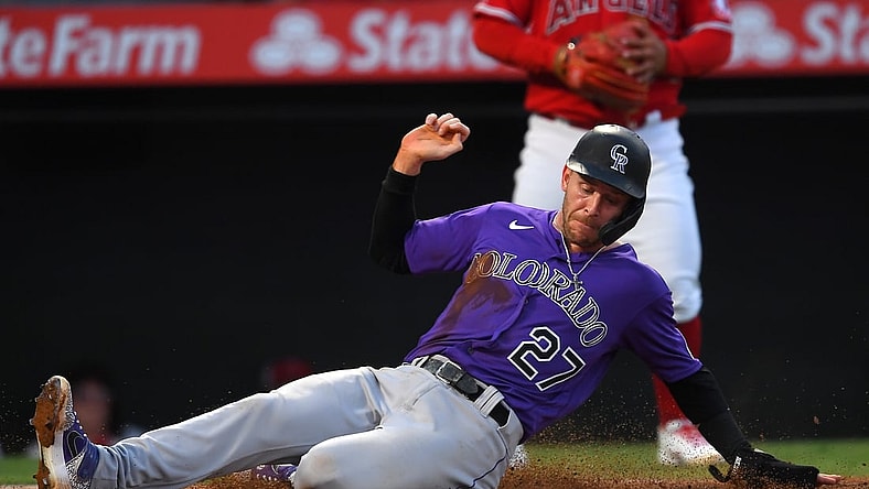 Jul 27, 2021; Anaheim, California, USA;  Colorado Rockies shortstop Trevor Story (27) scores on a single by right fielder Charlie Blackmon (not pictured) against the Colorado Rockies in the third inning at Angel Stadium. Mandatory Credit: Jayne Kamin-Oncea-USA TODAY Sports