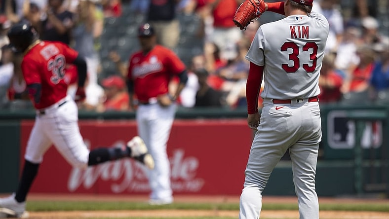 Jul 28, 2021; Cleveland, Ohio, USA; St. Louis Cardinals starting pitcher Kwang Hyun Kim (33) wipes his face during the third inning after giving up a second solo home run to Cleveland Indians right fielder Franmil Reyes at Progressive Field. Mandatory Credit: Scott Galvin-USA TODAY Sports