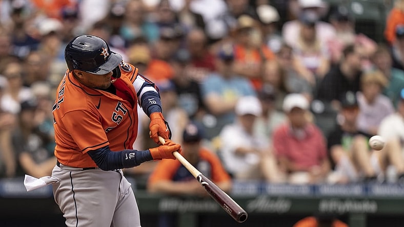 Jul 28, 2021; Seattle, Washington, USA;  Houston Astros first baseman Yuli Gurriel (10) hits a RBI-double off of Seattle Mariners starting pitcher Yusei Kikuchi (18)during the third inning of a game at T-Mobile Park. Mandatory Credit: Stephen Brashear-USA TODAY Sports