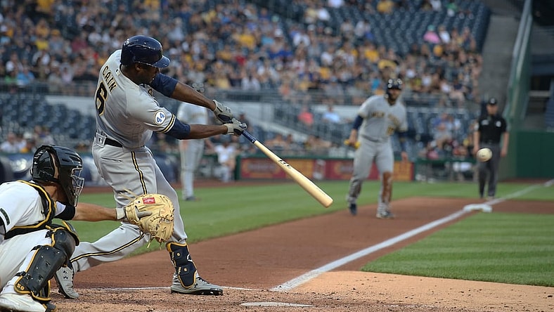 Jul 28, 2021; Pittsburgh, Pennsylvania, USA; Milwaukee Brewers center fielder Lorenzo Cain (6) hits a two run single against the Pittsburgh Pirates during the fourth inning at PNC Park. Mandatory Credit: Charles LeClaire-USA TODAY Sports