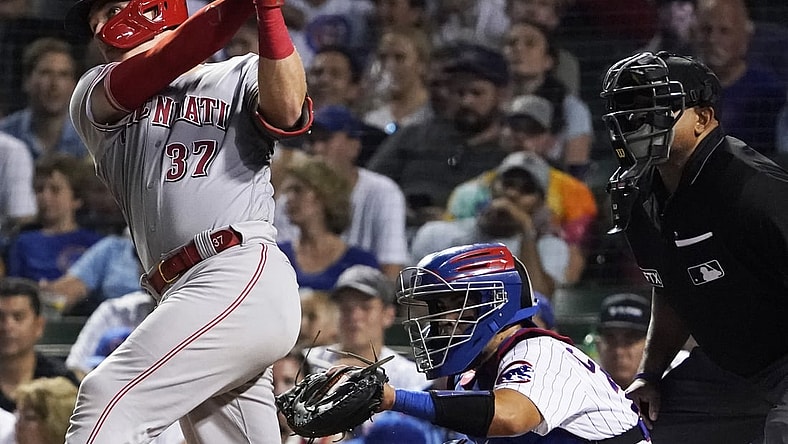 Jul 28, 2021; Chicago, Illinois, USA; Cincinnati Reds catcher Tyler Stephenson (37) hits a two run single against the Chicago Cubs during the fifth inning at Wrigley Field. Mandatory Credit: David Banks-USA TODAY Sports