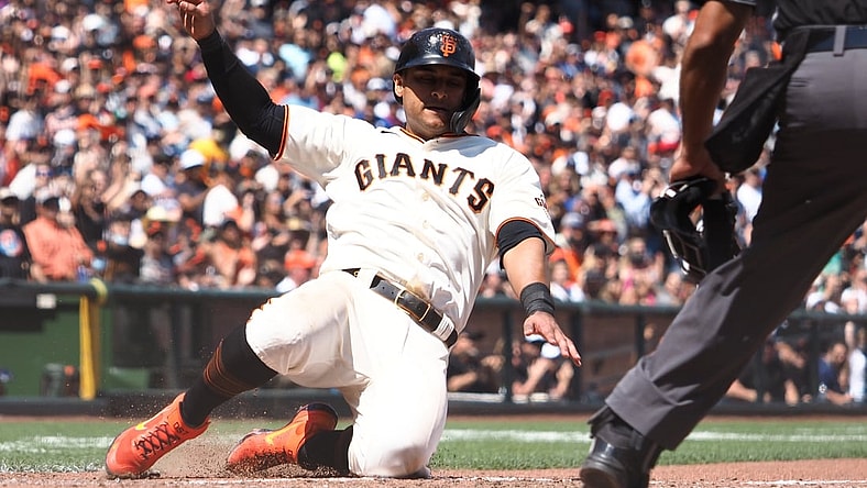 Jul 29, 2021; San Francisco, California, USA; San Francisco Giants second baseman Donovan Solano (7) scores a run against the Los Angeles Dodgers during the seventh inning at Oracle Park. Mandatory Credit: Kelley L Cox-USA TODAY Sports