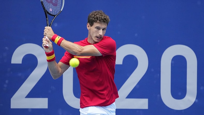 Jul 30, 2021; Tokyo, Japan; Pablo Carreno Busta (ESP) returns a shot from Karen Khachanov (ROC) in the men's singles semifinals during the Tokyo 2020 Olympic Summer Games at Ariake Tennis Park. Mandatory Credit: Robert Deutsch-USA TODAY Sports