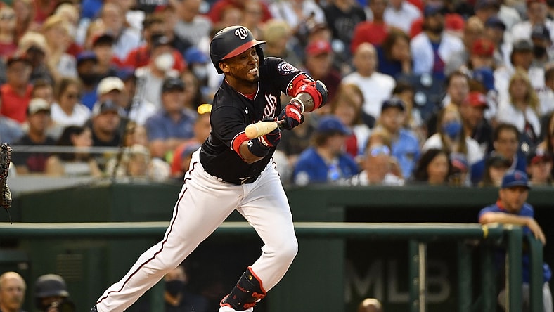 Jul 30, 2021; Washington, District of Columbia, USA; Washington Nationals shortstop Luis Garcia (2) hits a sacrifice bunt against the Chicago Cubs during the third inning at Nationals Park. Mandatory Credit: Brad Mills-USA TODAY Sports