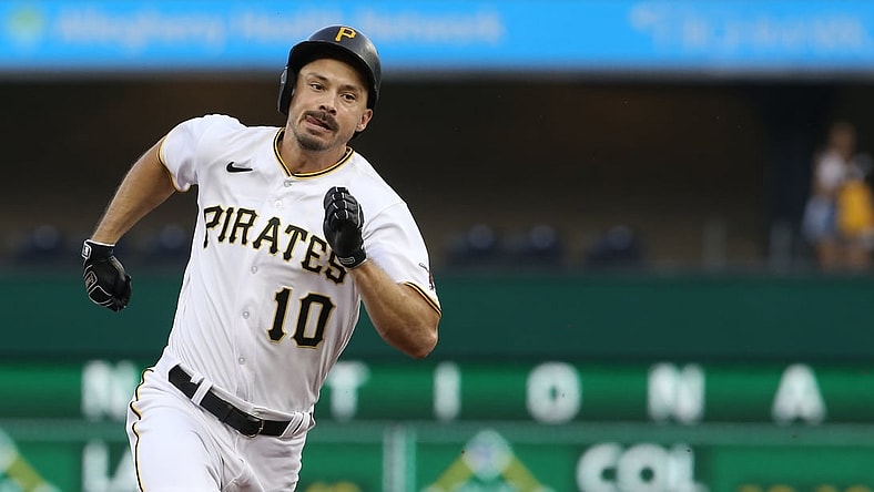 Jul 30, 2021; Pittsburgh, Pennsylvania, USA;  Pittsburgh Pirates center fielder Bryan Reynolds (10) runs to third base after hitting an RBI triple against the Philadelphia Phillies during the first inning at PNC Park. Mandatory Credit: Charles LeClaire-USA TODAY Sports