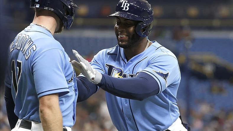 Jul 30, 2021; St. Petersburg, Florida, USA; Tampa Bay Rays first baseman Yandy Diaz (2) is congratulated by Tampa Bay Rays left fielder Austin Meadows (17) after he hit a two run home run during the first inning against the Boston Red Sox at Tropicana Field. Mandatory Credit: Kim Klement-USA TODAY Sports
