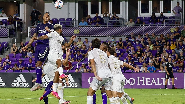 Jul 30, 2021; Orlando, Florida, USA;  Orlando City defender Antonio Carlos (25) heads the ball in the box during the first half against Atlanta United at Orlando City Stadium. Mandatory Credit: Nathan Ray Seebeck-USA TODAY Sports