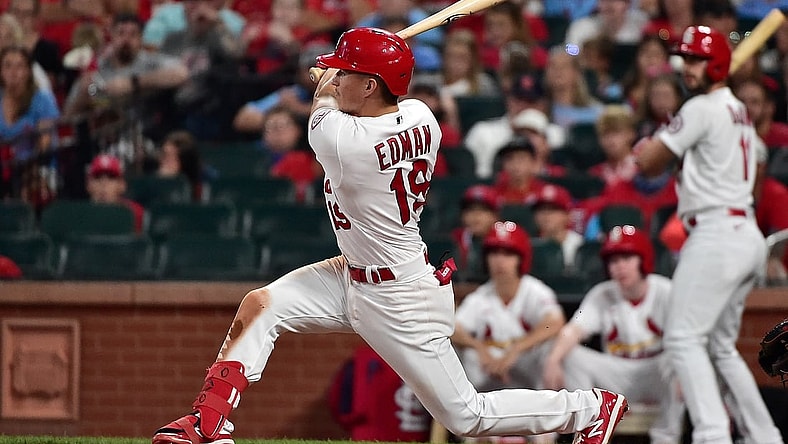 Jul 30, 2021; St. Louis, Missouri, USA;  St. Louis Cardinals second baseman Tommy Edman (19) hits a three run double during the sixth inning against the Minnesota Twins at Busch Stadium. Mandatory Credit: Jeff Curry-USA TODAY Sports