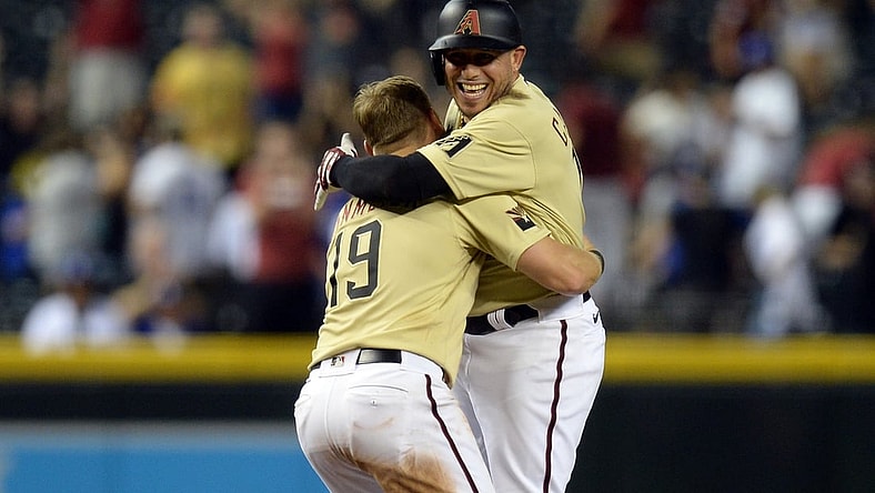 Jul 30, 2021; Phoenix, Arizona, USA; Arizona Diamondbacks third baseman Asdrubal Cabrera (14) celebrates after a walk off RBI single against the Los Angeles Dodgers during the tenth inning at Chase Field. Mandatory Credit: Joe Camporeale-USA TODAY Sports