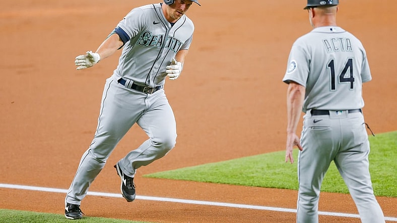 Jul 31, 2021; Arlington, Texas, USA; Seattle Mariners third baseman Kyle Seager (15) runs the bases after hitting a home run against the Texas Rangers during the first inning at Globe Life Field. Mandatory Credit: Andrew Dieb-USA TODAY Sports