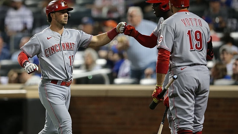 Jul 31, 2021; New York City, New York, USA; Cincinnati Reds shortstop Kyle Farmer (17) celebrates his solo home run against the New York Mets with right fielder Aristides Aquino (44) and first baseman Joey Votto (19) during the fifth inning at Citi Field. Mandatory Credit: Brad Penner-USA TODAY Sports