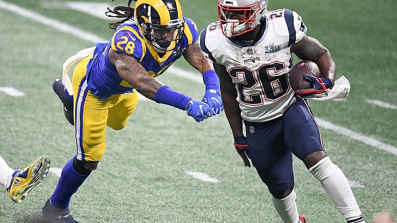 Feb 3, 2019; Atlanta, GA, USA; New England Patriots running back Sony Michel (right) is defended by Los Angeles Rams inside linebacker Mark Barron (left) in Super Bowl LIII at Mercedes-Benz Stadium. The Patriots defeated the Rams 13-3 to win an NFL record-tying sixth championship. Mandatory Credit: Kirby Lee-USA TODAY Sports