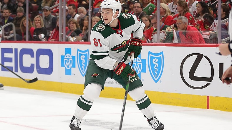 Dec 15, 2019; Chicago, IL, USA; Minnesota Wild defenseman Brennan Menell (61) with the puck during the first period against the Chicago Blackhawks at United Center. Mandatory Credit: Dennis Wierzbicki-USA TODAY Sports
