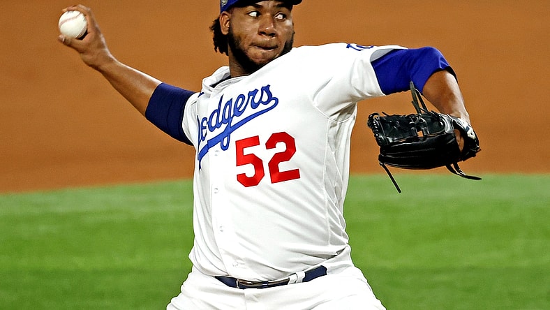 Oct 27, 2020; Arlington, Texas, USA; Los Angeles Dodgers relief pitcher Pedro Baez (52) pitches during the fifth inning against the Tampa Bay Rays during game six of the 2020 World Series at Globe Life Field. Mandatory Credit: Kevin Jairaj-USA TODAY Sports