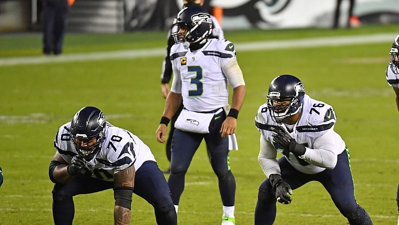 Nov 30, 2020; Philadelphia, Pennsylvania, USA; Seattle Seahawks offensive guard Mike Iupati (70) and offensive tackle Duane Brown (76) wait for the snap against the Philadelphia Eagles at Lincoln Financial Field. Mandatory Credit: Eric Hartline-USA TODAY Sports