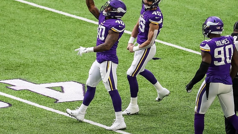 Dec 20, 2020; Minneapolis, Minnesota, USA; Minnesota Vikings linebacker Todd Davis (40) celebrates his sack with linebacker Troy Dye (45) during the first quarter against the Chicago Bears at U.S. Bank Stadium. Mandatory Credit: Brace Hemmelgarn-USA TODAY Sports