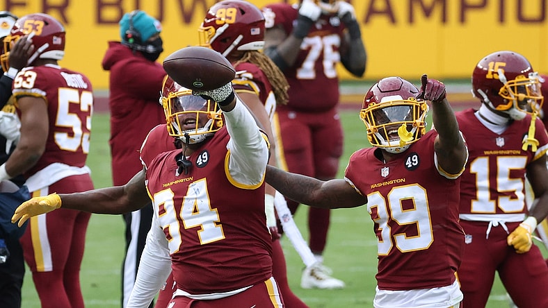 Dec 20, 2020; Landover, Maryland, USA; Washington Football Team nose tackle Daron Payne (94) celebrates with teammates after intercepting a pass against the Seattle Seahawks in the fourth quarter at FedExField. Mandatory Credit: Geoff Burke-USA TODAY Sports