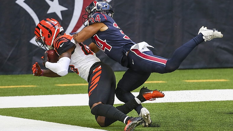 Dec 27, 2020; Houston, Texas, USA; Cincinnati Bengals wide receiver Tee Higgins (85) makes a reception for a touchdown against Houston Texans cornerback John Reid (34) during the third quarter at NRG Stadium. Mandatory Credit: Troy Taormina-USA TODAY Sports