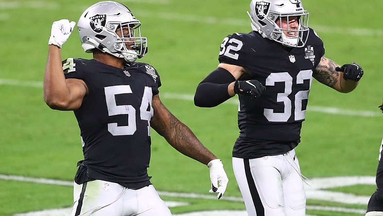 Dec 17, 2020; Paradise, Nevada, USA; Las Vegas Raiders linebacker Raekwon McMillan (54) celebrates a play with safety Dallin Leavitt (32) against the Los Angeles Chargers at Allegiant Stadium. Mandatory Credit: Mark J. Rebilas-USA TODAY Sports