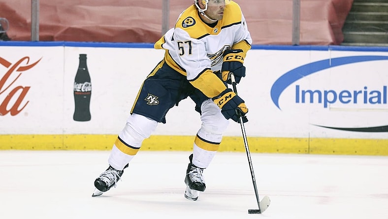 Mar 20, 2021; Sunrise, Florida, USA; Nashville Predators defenseman Dante Fabbro (57) skates with the puck against the Florida Panthers during the second period at BB&T Center. Mandatory Credit: Sam Navarro-USA TODAY Sports