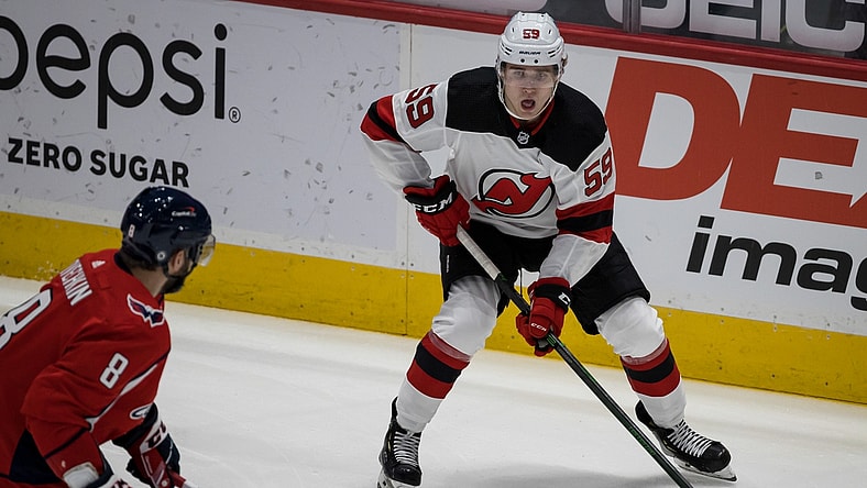 Mar 25, 2021; Washington, District of Columbia, USA; New Jersey Devils left wing Janne Kuokkanen (59) skates with the puck against the Washington Capitals during the first period at Capital One Arena. Mandatory Credit: Scott Taetsch-USA TODAY Sports