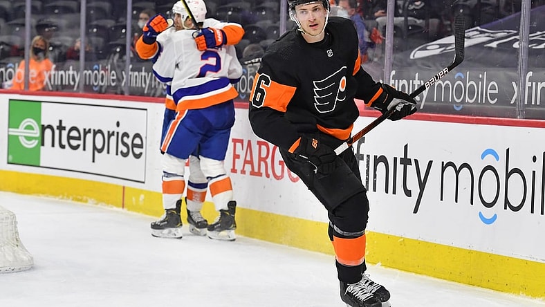Apr 18, 2021; Philadelphia, Pennsylvania, USA;  Philadelphia Flyers defenseman Travis Sanheim (6) skates away as New York Islanders defenseman Nick Leddy (2) celebrates his game winning goal in overtime at Wells Fargo Center. Mandatory Credit: Eric Hartline-USA TODAY Sports