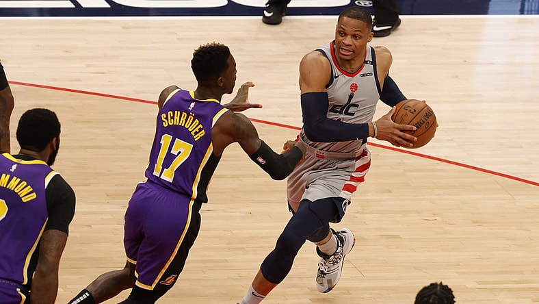 Apr 28, 2021; Washington, District of Columbia, USA; Washington Wizards guard Russell Westbrook (4) drives to the basket as Los Angeles Lakers guard Dennis Schroder (17) defends in the first quarter at Capital One Arena. Mandatory Credit: Geoff Burke-USA TODAY Sports